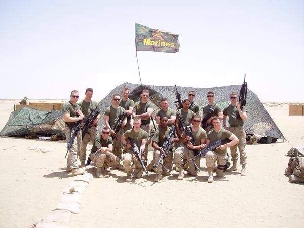 Rev. Moises E. Ortega with fellow Marines in the field — a testament to his service and commitment.